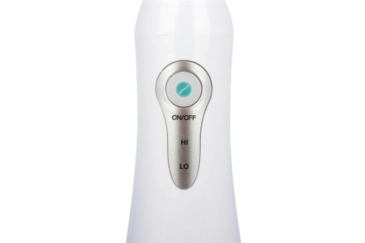 portable waterpik toothbrush botton